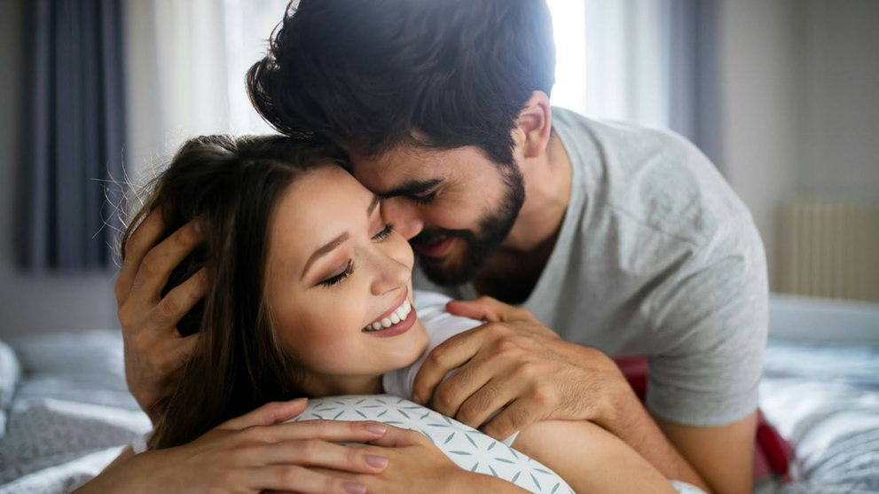 Couple embracing in apex sex position