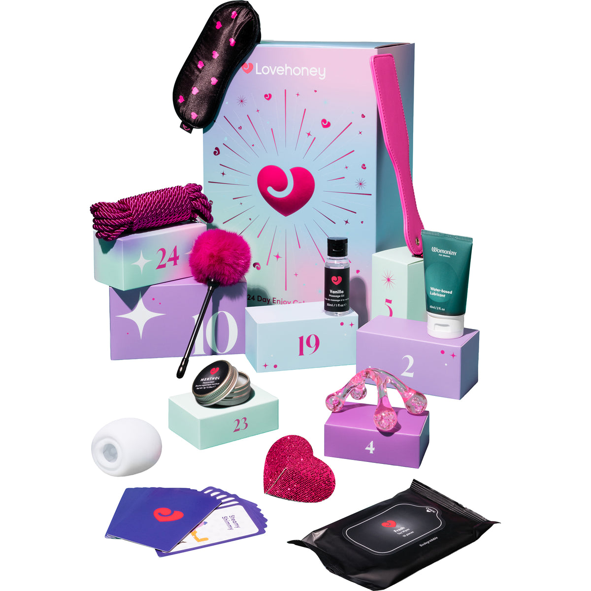 Lovehoney Valentine's Day advent kit with a pastel gift box, sleep mask, numbered boxes, pink accessories, skincare items, and a black pouch of wipes on a white background.