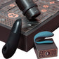 Sex toy set with a matte black curved vibrator, a black cylindrical wand-style piece, and a teal curved insert, arranged with a dark patterned box featuring numbered compartments.