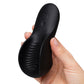 A hand holding a black personal massager against a plain white background. The device has a curved ergonomic shape with textured grooves and three control buttons on the back, with the brand name 'We-Vibe' debossed on the side.