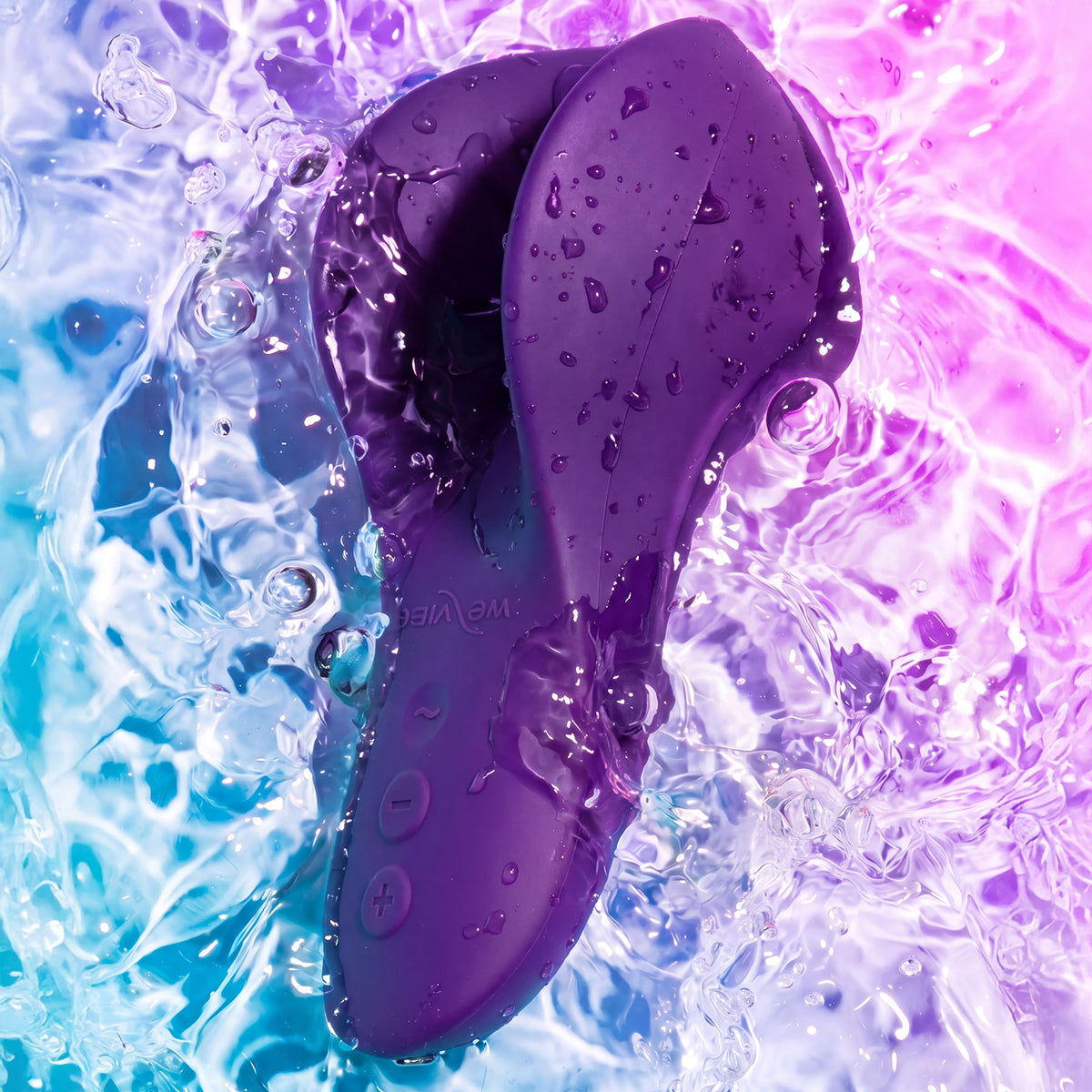 A purple silicone personal massager with water droplets, shown against a dynamic background of blue, purple, and pink water splashes.