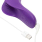 A close-up of a purple personal massager with a white USB charging cable on a light gray background. The brand name 'We-Vibe' is embossed on the side of the device.