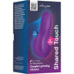 Product packaging box for the Purple We-Vibe Shared Touch couple's grinding vibrator, featuring a purple and magenta gradient design with product imagery and feature callouts.