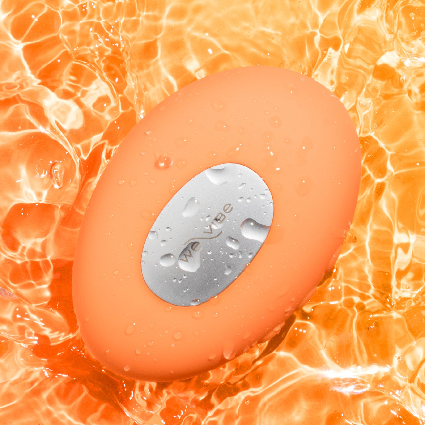 Temp By We-Vibe Heating & Cooling Rechargeable Silicone Lay-On Vibrator - Tangerine